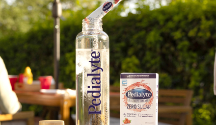 Man mixing Pedialyte in Water