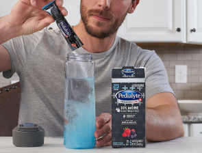 Man mixing Pedialyte in Water
