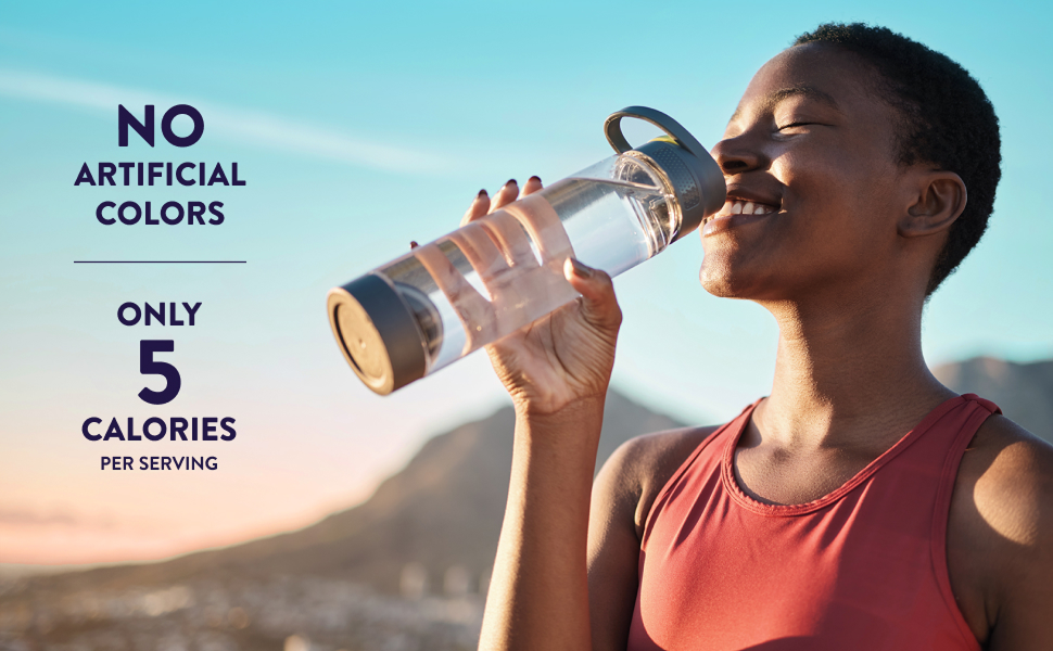 Woman smiling and sipping Pedialyte zero-sugar electrolyte drink from a clear water bottle. NO artificial colors, only 5 calories per serving.